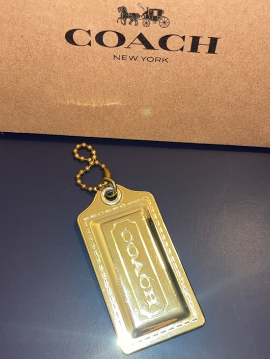 Coach Accessories - Coach large poppy metallic gold-tone hang tag EUC